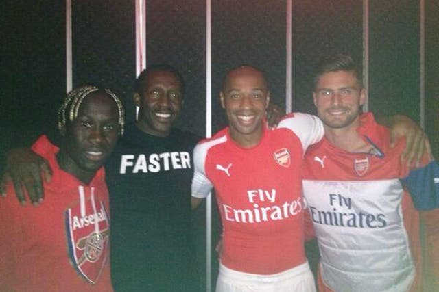 (L-R) Bacary Sagna, Linford Christie, Thierry Henry and Olivier Giroud pictured together with Henry wearing a Puma-branded Arsenal kit