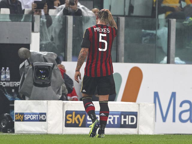 Philippe Mexes walks after bring shown a red card