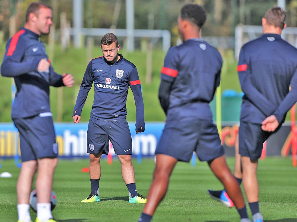Jack Wilshere stretches during England training