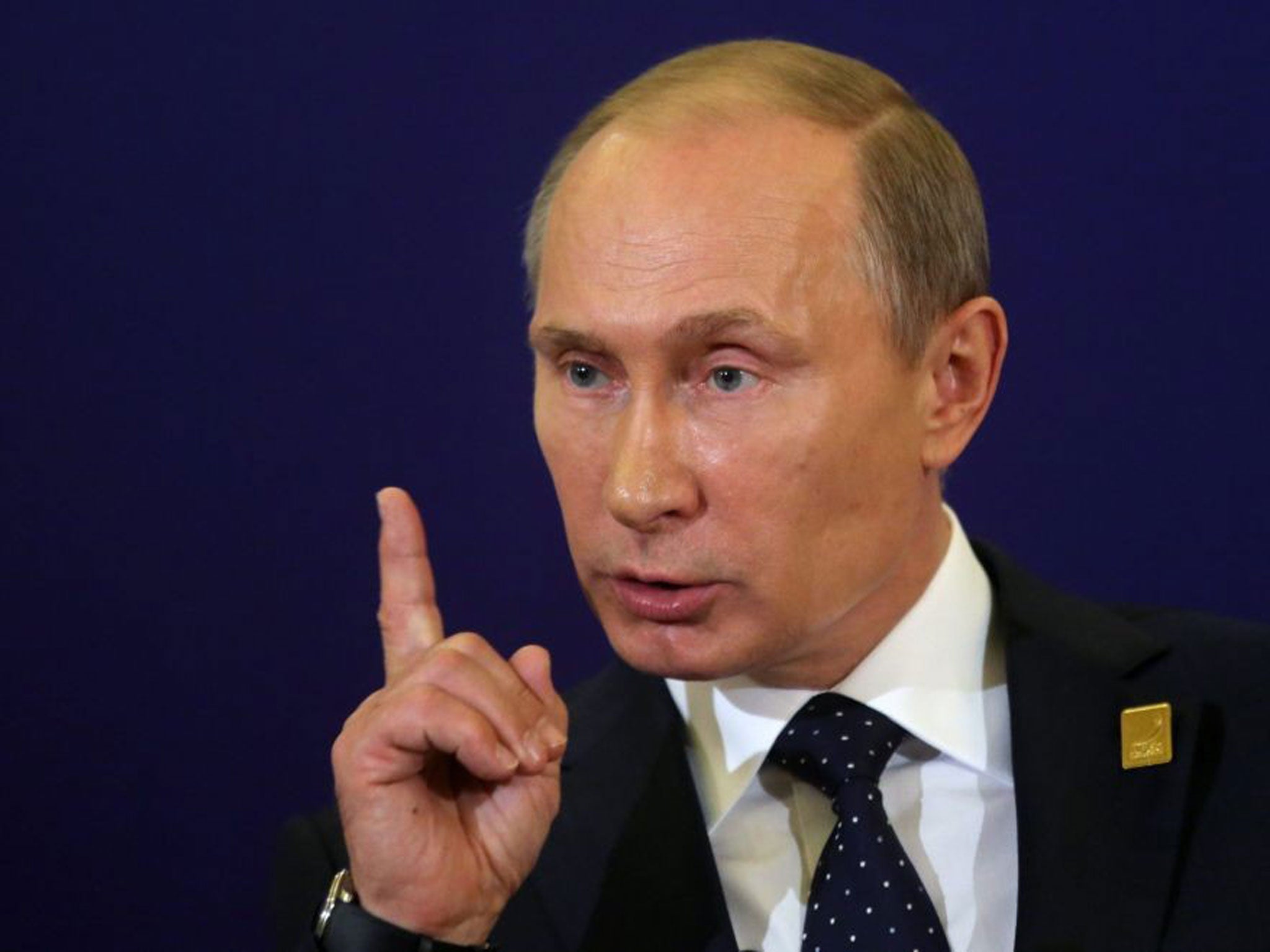 Vladimir Putin, seen here at a press conference on the last day of the Asia-Pacific Economic Cooperation (APEC) Summit in Indonesia, has demanded an apology from the Netherlands over the arrest of a Russian diplomat