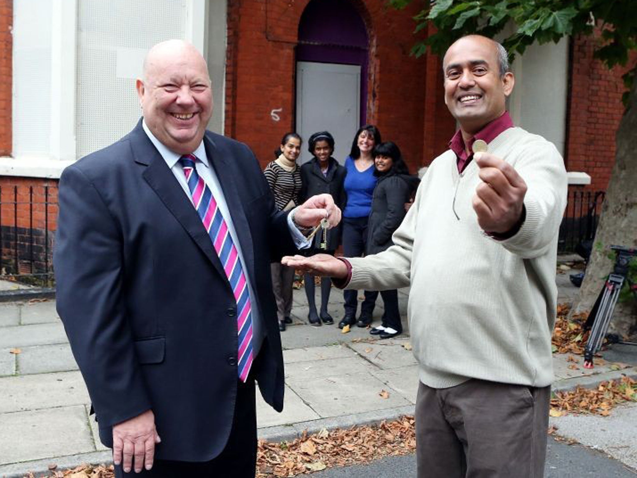 Mr Jayalal Madde and his family has become the first to buy a house from the Council for £1. Liverpool City Council Mayor Joe Anderson handed the keys over to the taxi driver