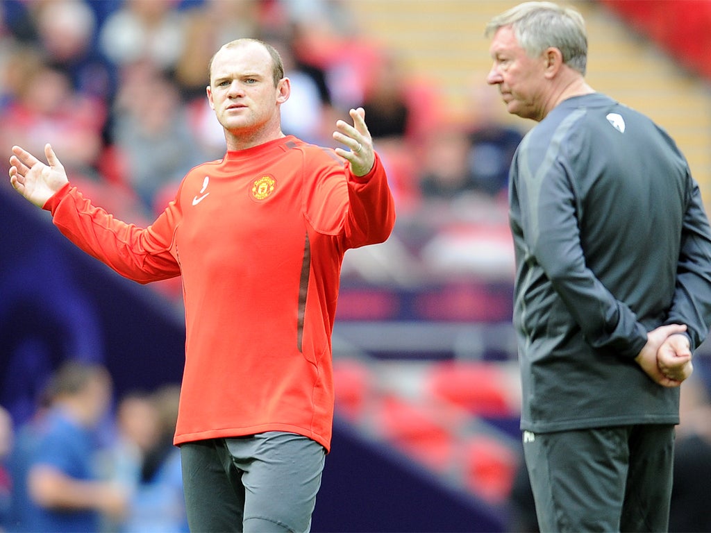 Wayne Rooney (left) and Sir Alex Ferguson's relationship turned sour last season