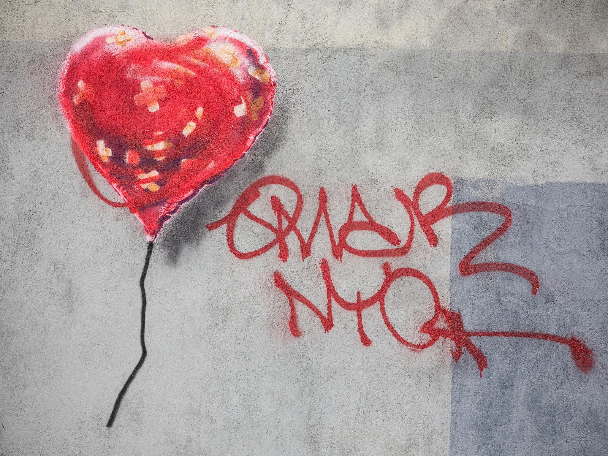 'Bandaged Heart Balloon' depicting a heart-shaped balloon covered in bandages was defaced with red spray paint