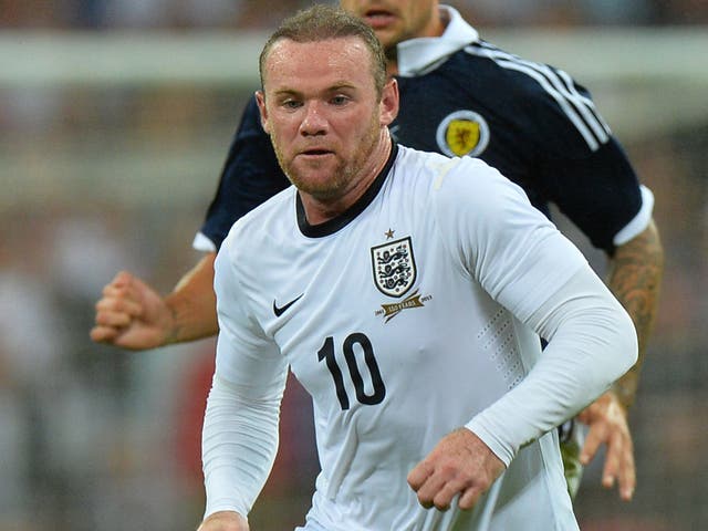 Wayne Rooney in action against Scotland