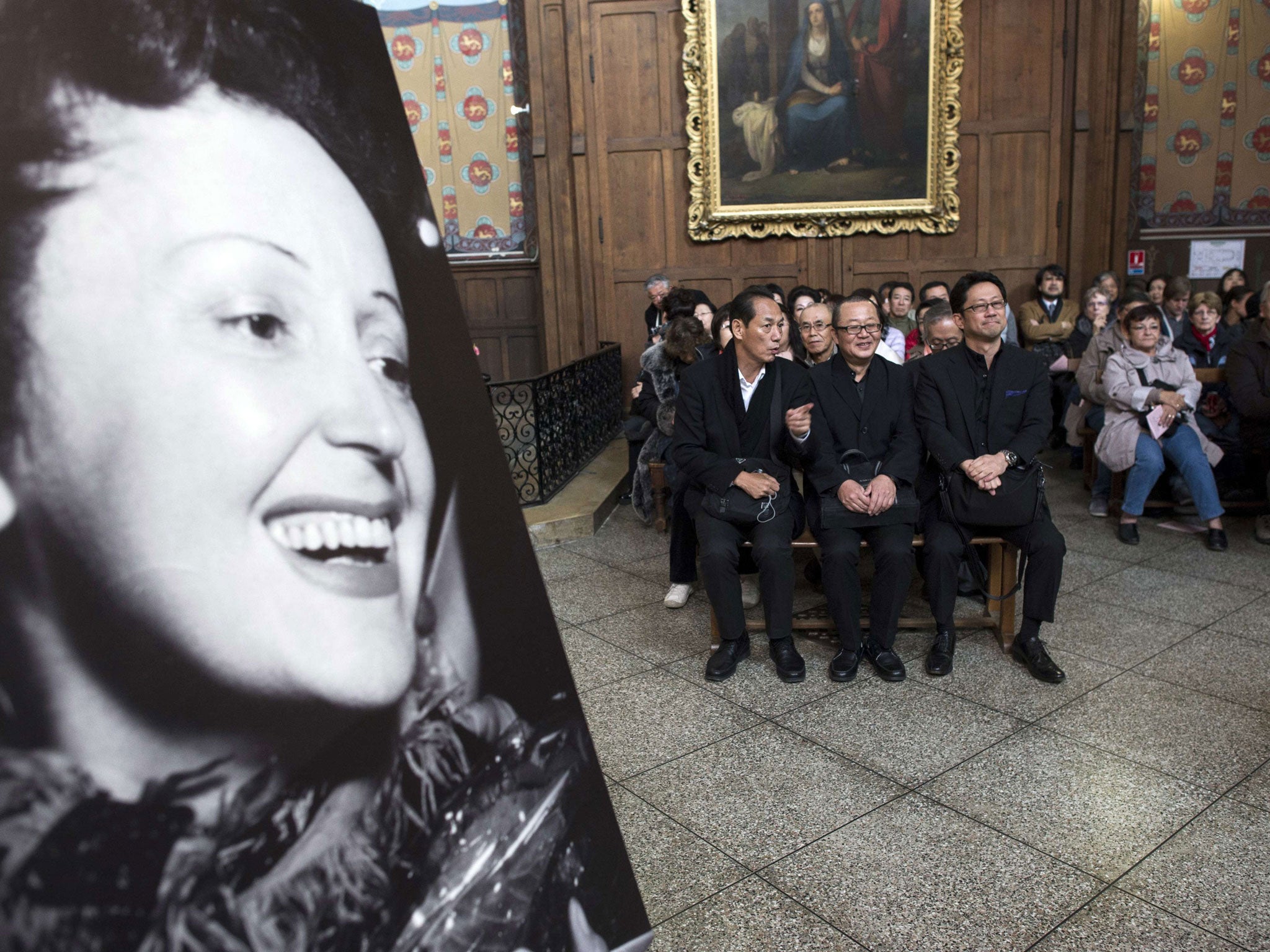 The congregation at the service for Edith Piaf, the French singer, whose song 'La Vie en Rose' has inspired many books and films