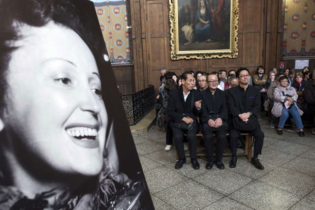 The congregation at the service for Edith Piaf, the French singer, whose song 'La Vie en Rose' has inspired many books and films