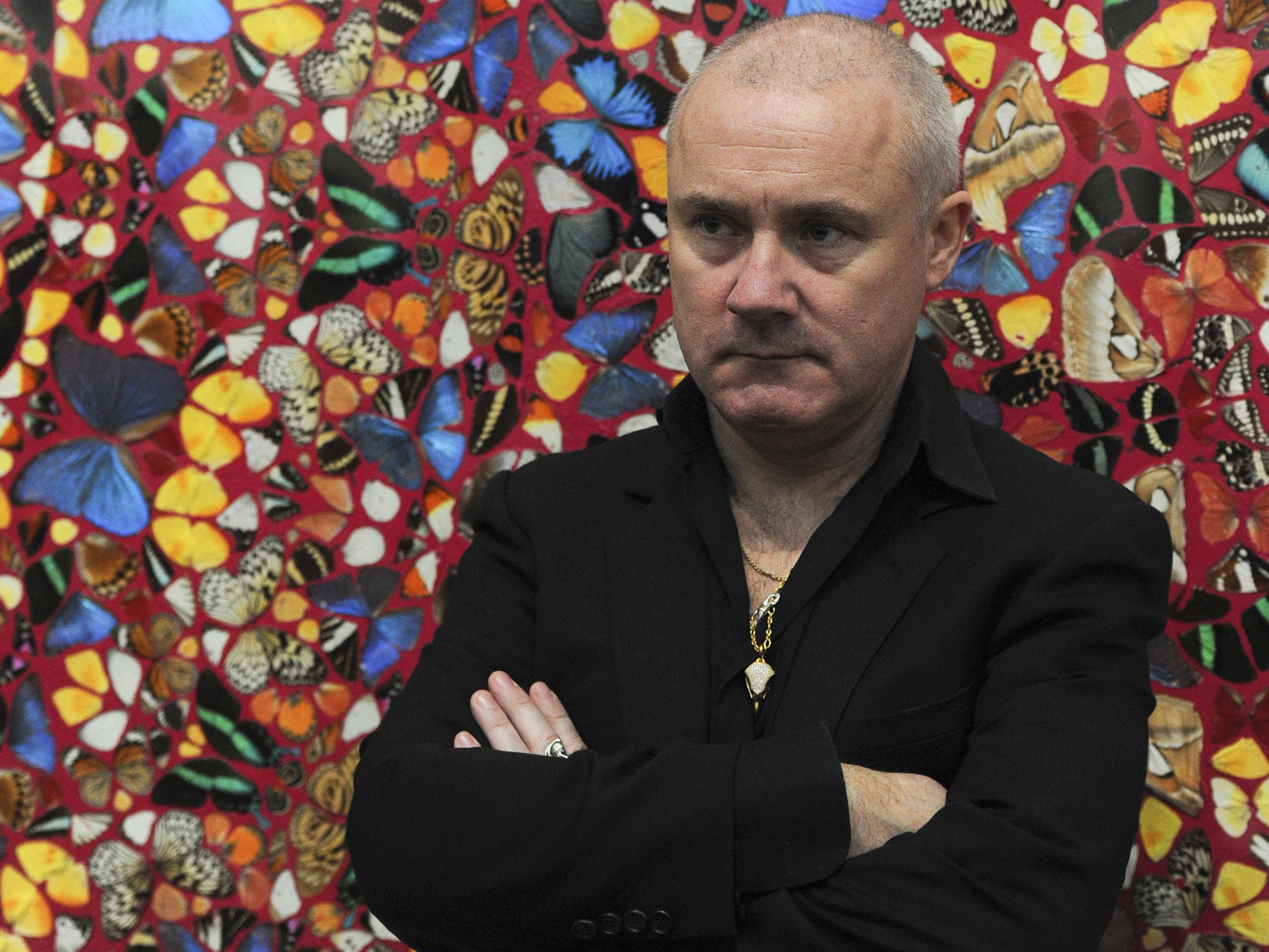 Damien Hirst stands in front of his artwork, 'I Am Become Death, Shatterer of Worlds 2006'