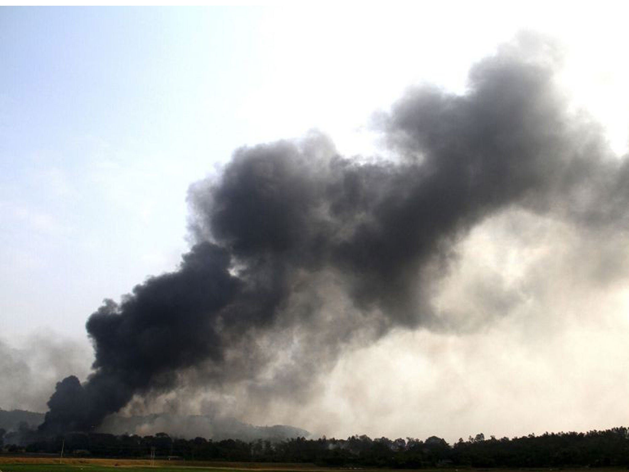 Smoke billows following an explosion at a fireworks factory in a military compound in Vietnam's northern Phu Tho province, about 100 km (62miles) from Hanoi 12 October