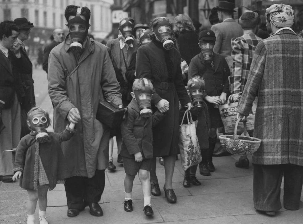 Chilling sight: A family during a gas-attack drill in Richmond, Surrey, in May 1941