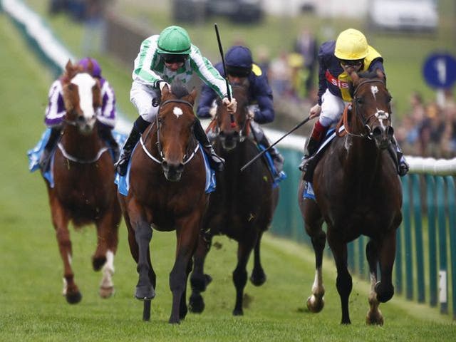 Green for go: Joseph O’Brien drives War Command (left) to victory in the Dewhurst Stakes on Future Champions Day
