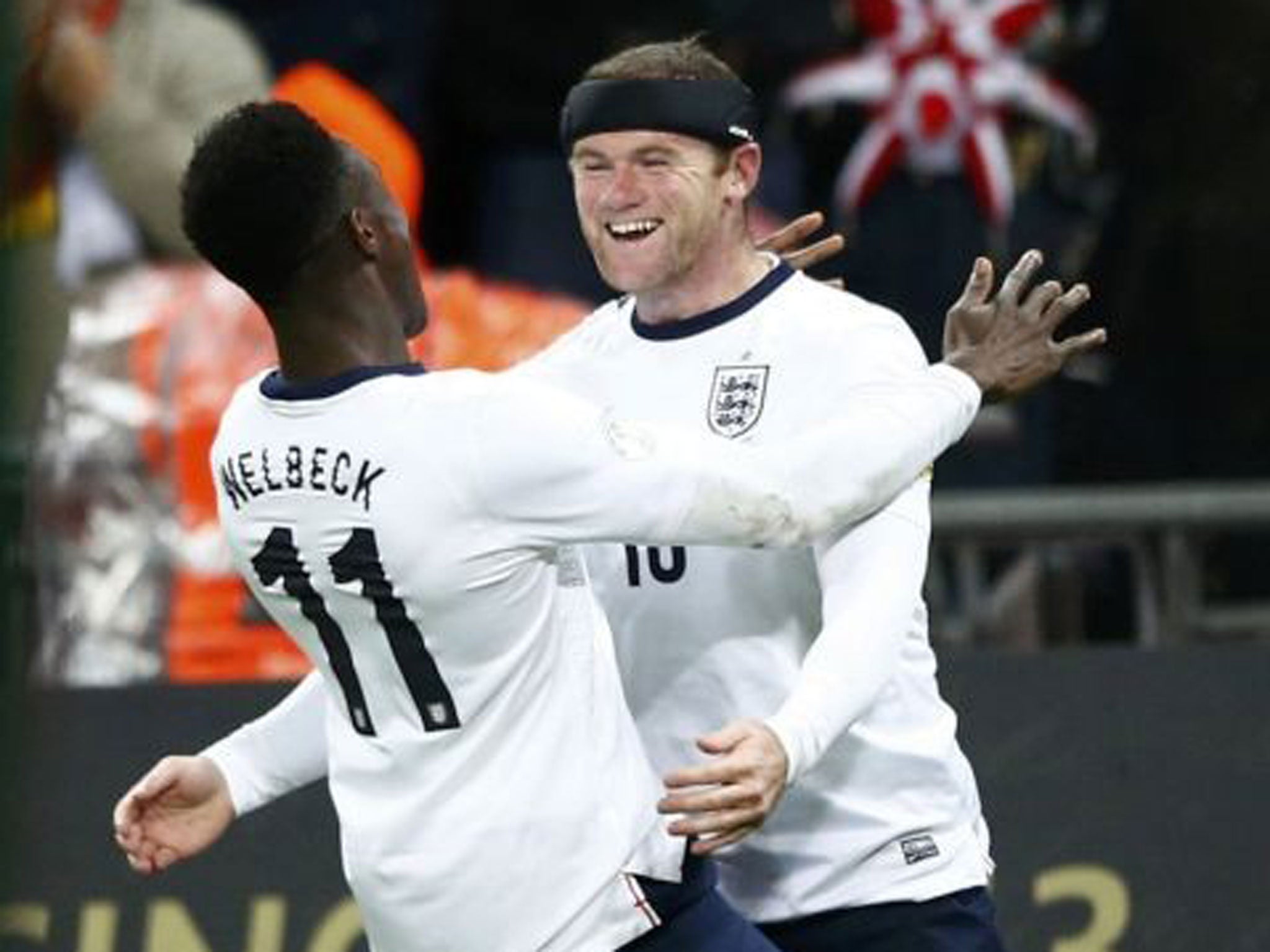 Opening salvo: Wayne Rooney celebrates with Danny Welbeck after he scored England’s first goal against Montenegro on Friday night reuters