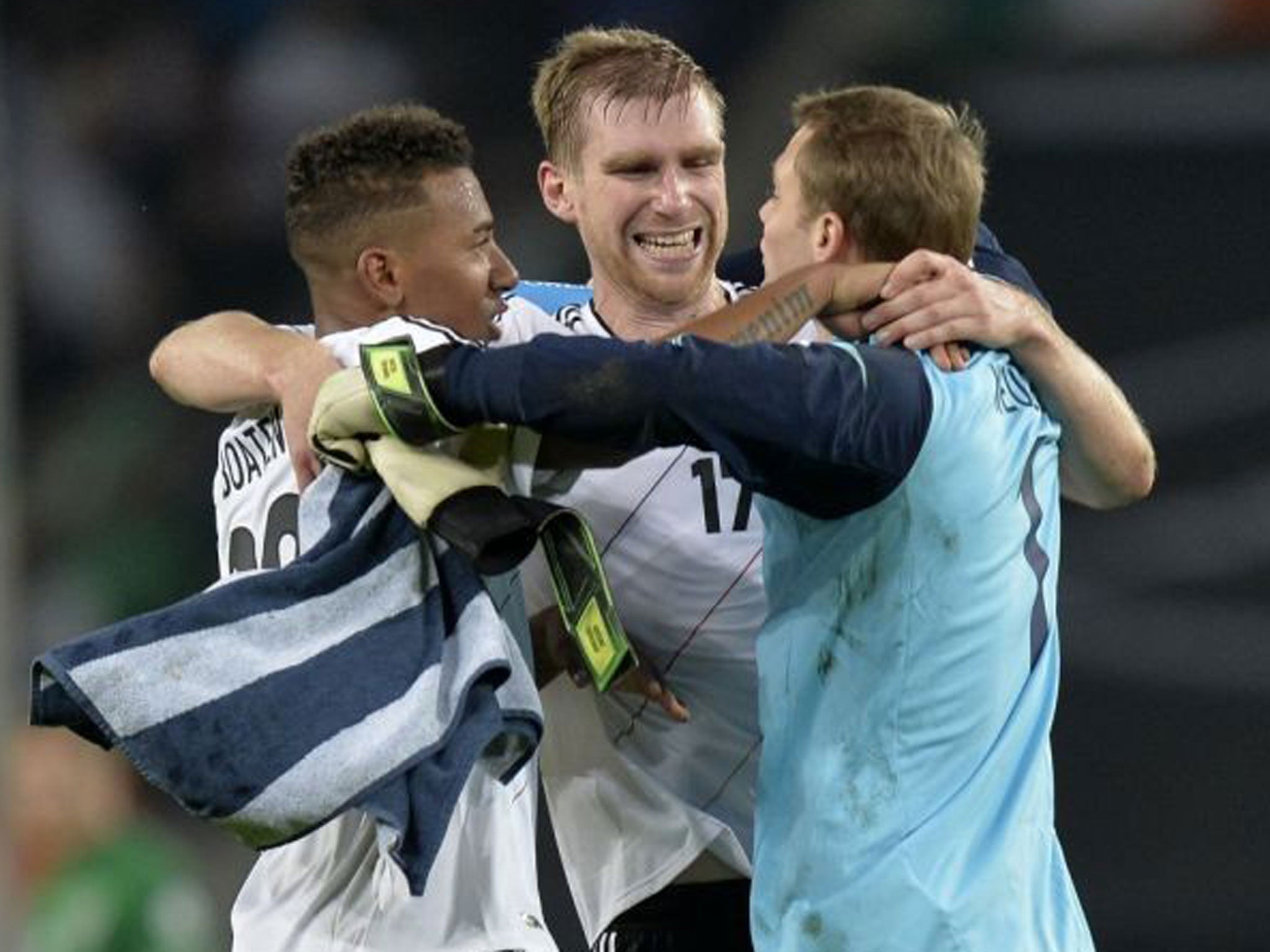 Germany team-mates Mertesacker, Jérôme Boateng and Manuel Neuer celebrate