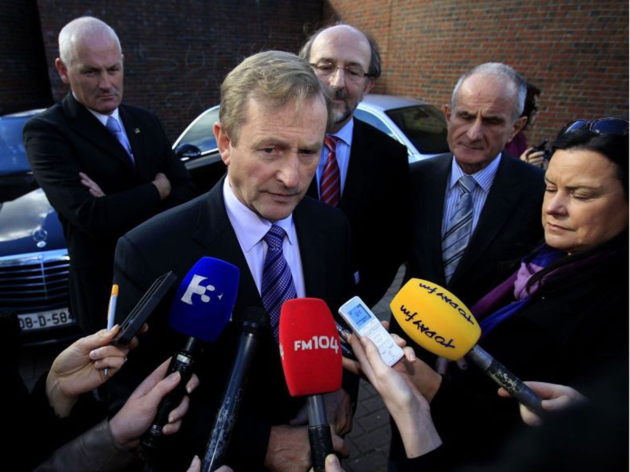 Taoiseach Enda Kenny speaks to members of the media. He has confirmed that Ireland will exit its strict bailout programme by the end of the year