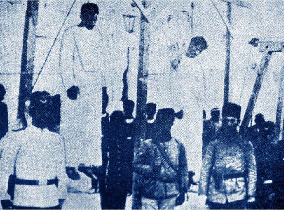Ottoman soldiers posing in front of Armenians they had hanged in public in Alep in 1915