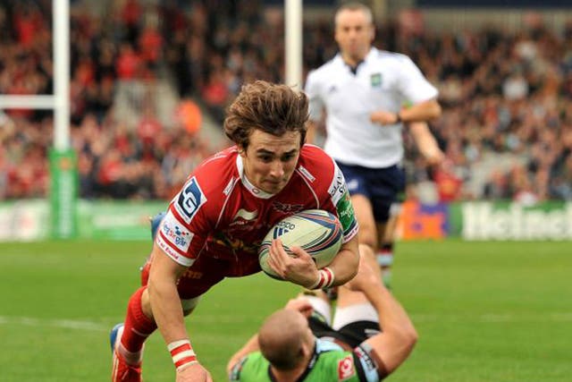 Scarlets’ Rhodri Williams dives in to score the first try on Saturday