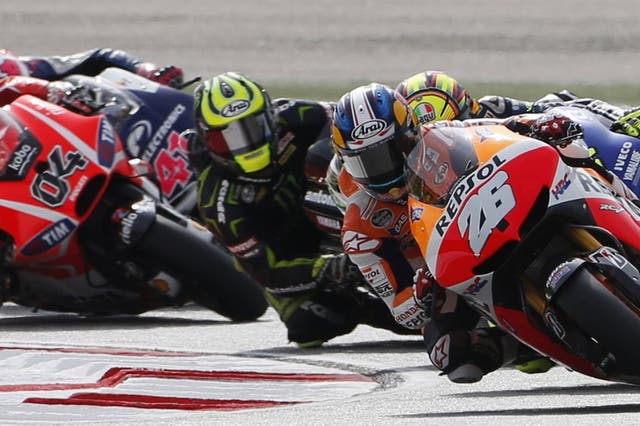 Dani Pedrosa (26) leads the pack on his way to victory at the Malaysian Moto GP in Sepang