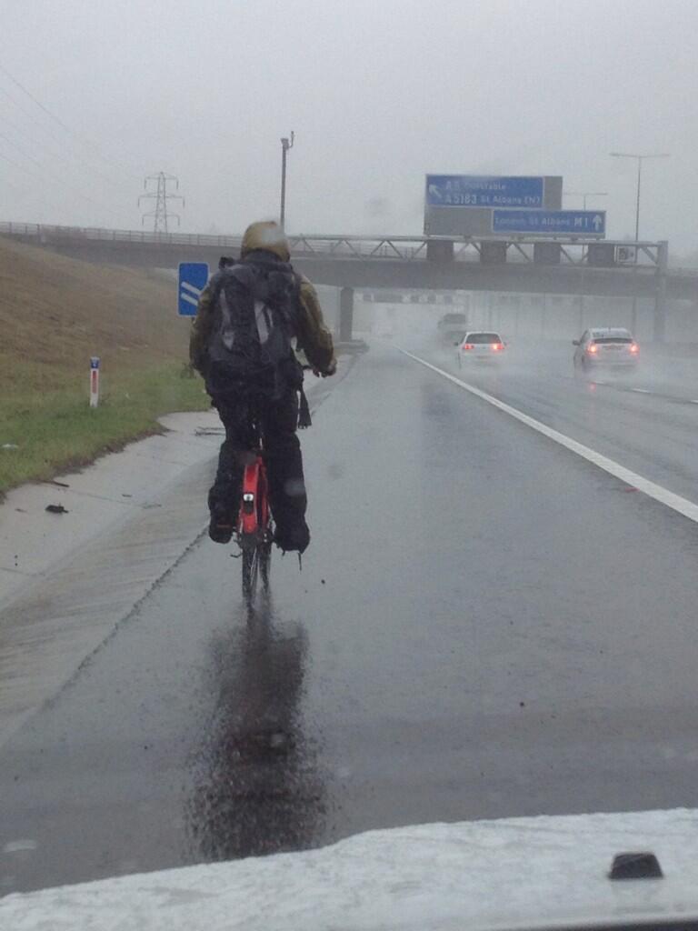A picture tweeted by police of an unnamed man riding his bike up the hard shoulder on the M1