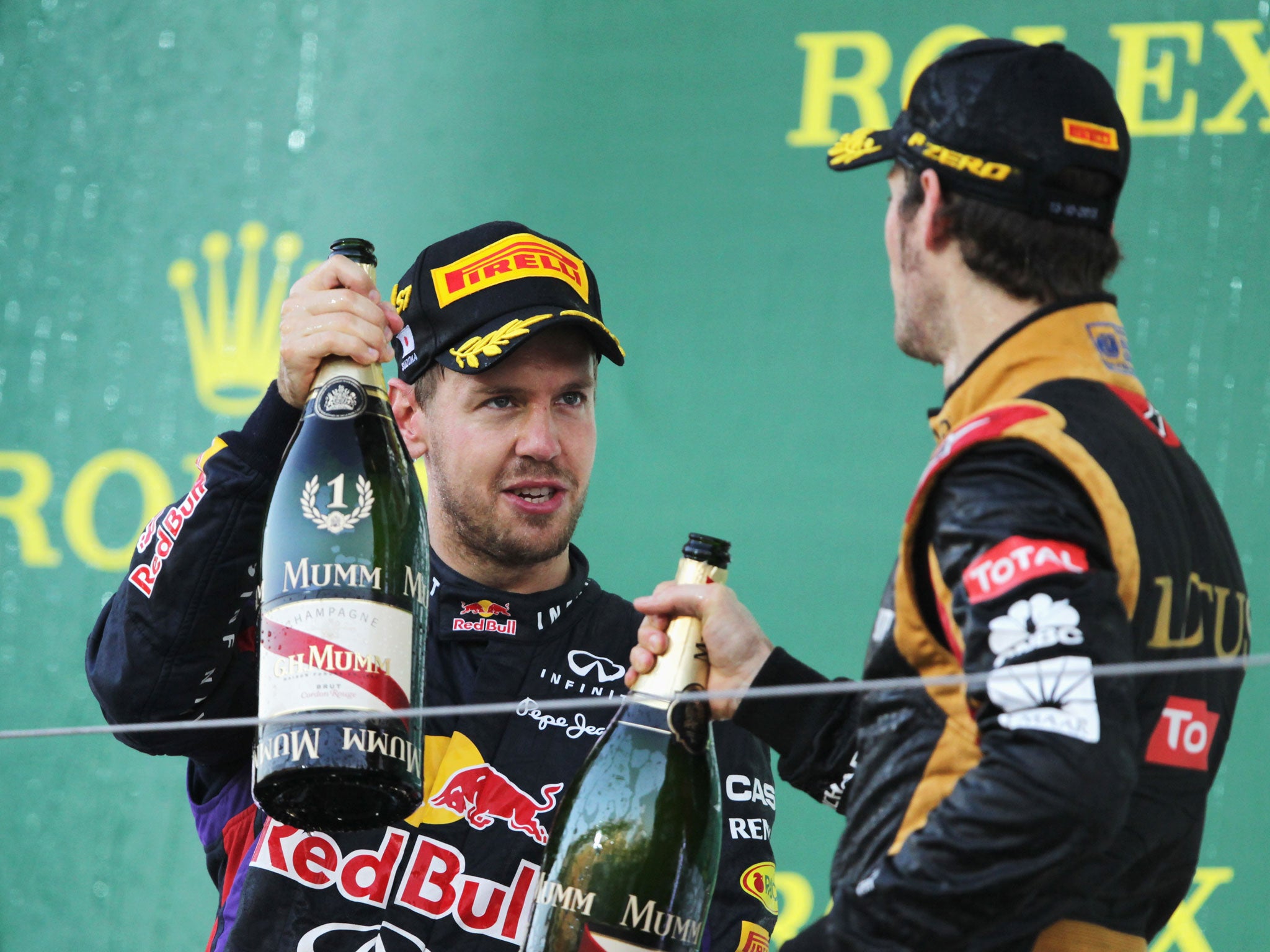 Sebastian Vettel celebrates his Japanese Grand Prix victory in which he passed Romain Grosjean for the win