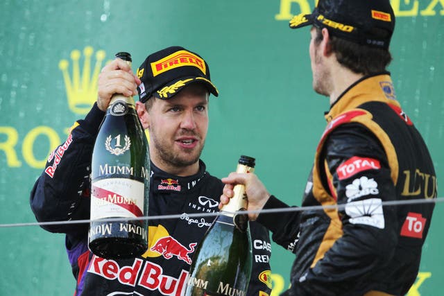 Sebastian Vettel celebrates his Japanese Grand Prix victory in which he passed Romain Grosjean for the win
