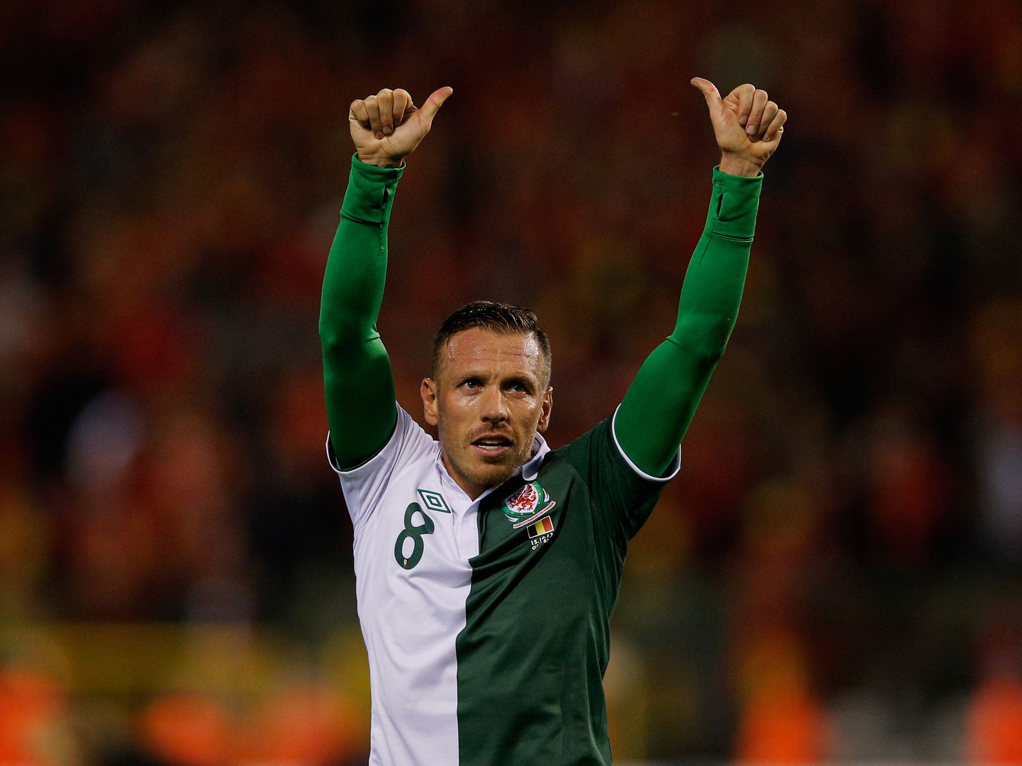 Craig Bellamy waves goodbye to the Wales fans as he retires from international football after their 1-1 draw with Belgium