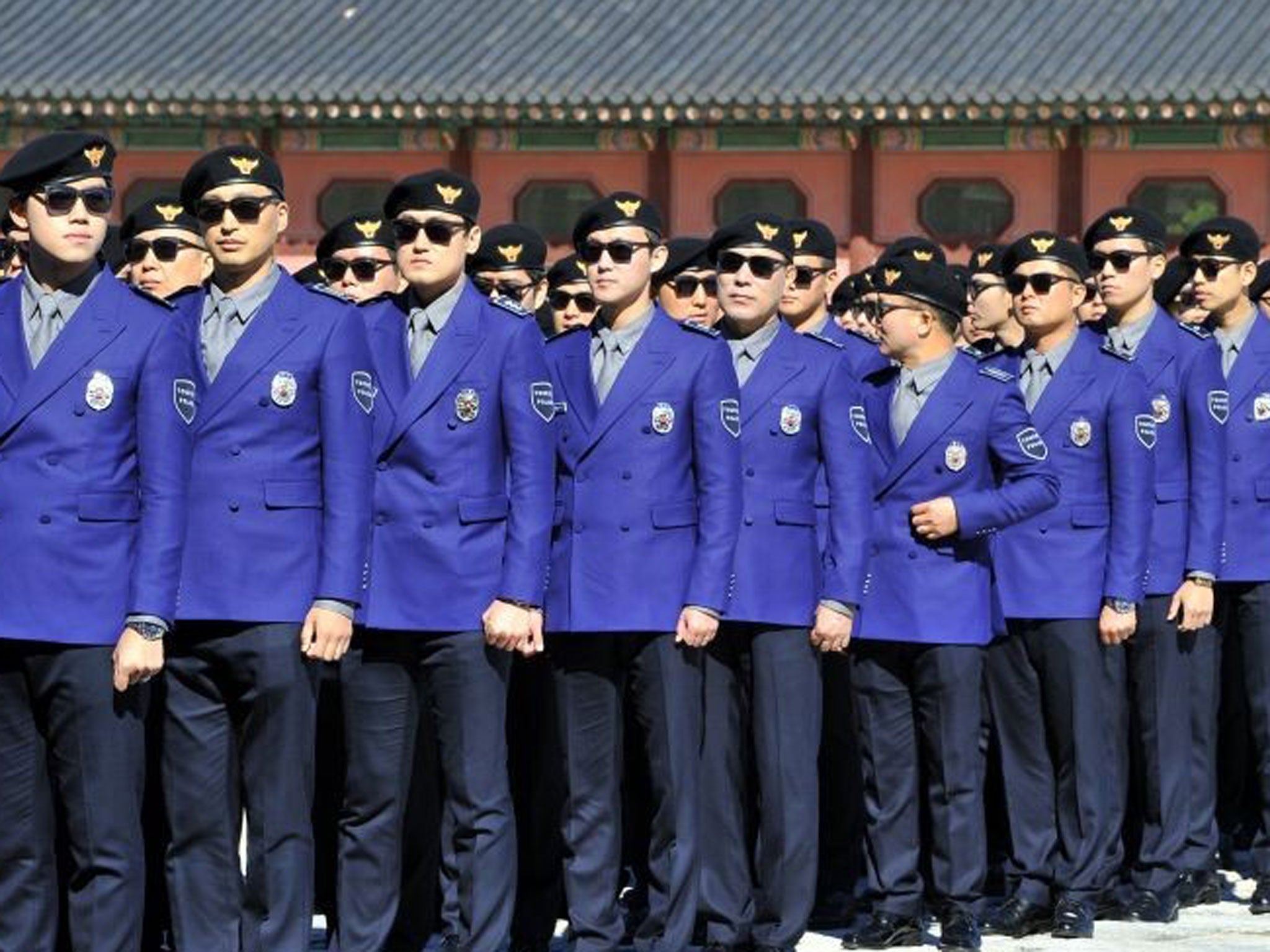 South Korean "tourist police" officers attend their inauguration ceremony at Gwanghwamun square in Seoul on 16 October, 2013.