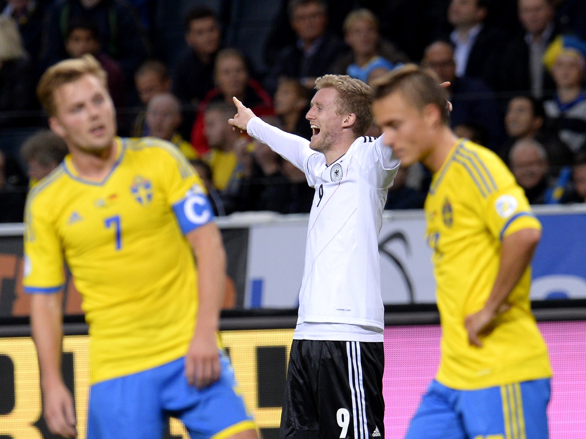 Andre Schurrle celebrates during the 5-3 win over Sweden