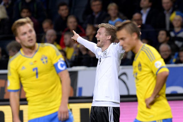 Andre Schurrle celebrates during the 5-3 win over Sweden