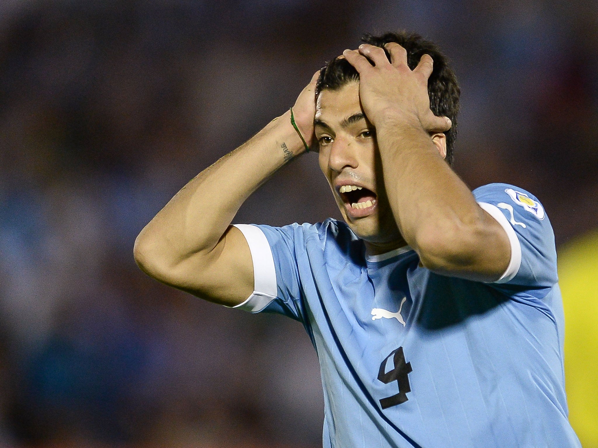 Luis Suarez reacts during Uruguay's 3-2 victory over Argentina