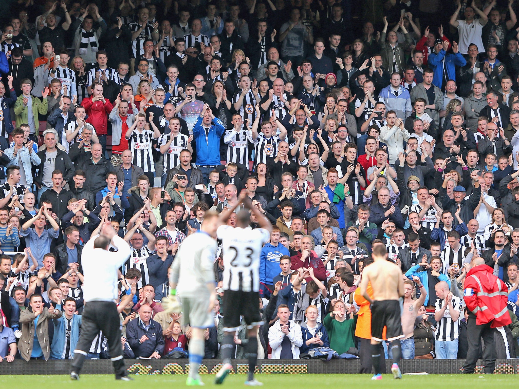 Newcastle players thank their away fans earlier this season