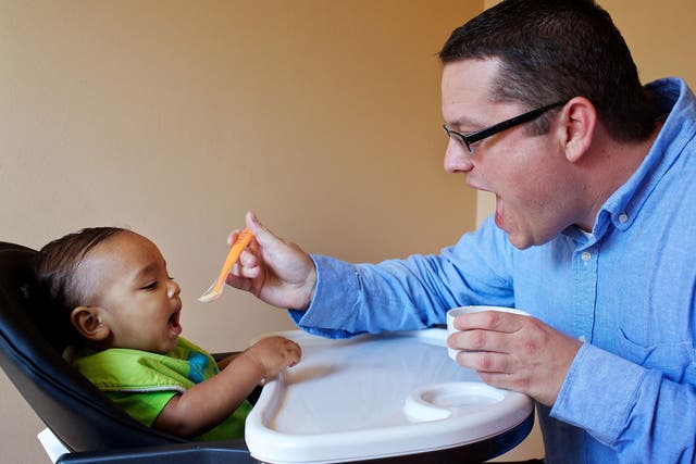 The food writer Nevin Martell feeds a homemade purée to his son Zephyr