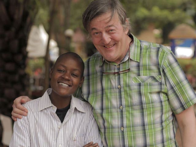 Sympathy for the devils: Stephen Fry with Stosh, a victim of ‘corrective rape’ in Uganda