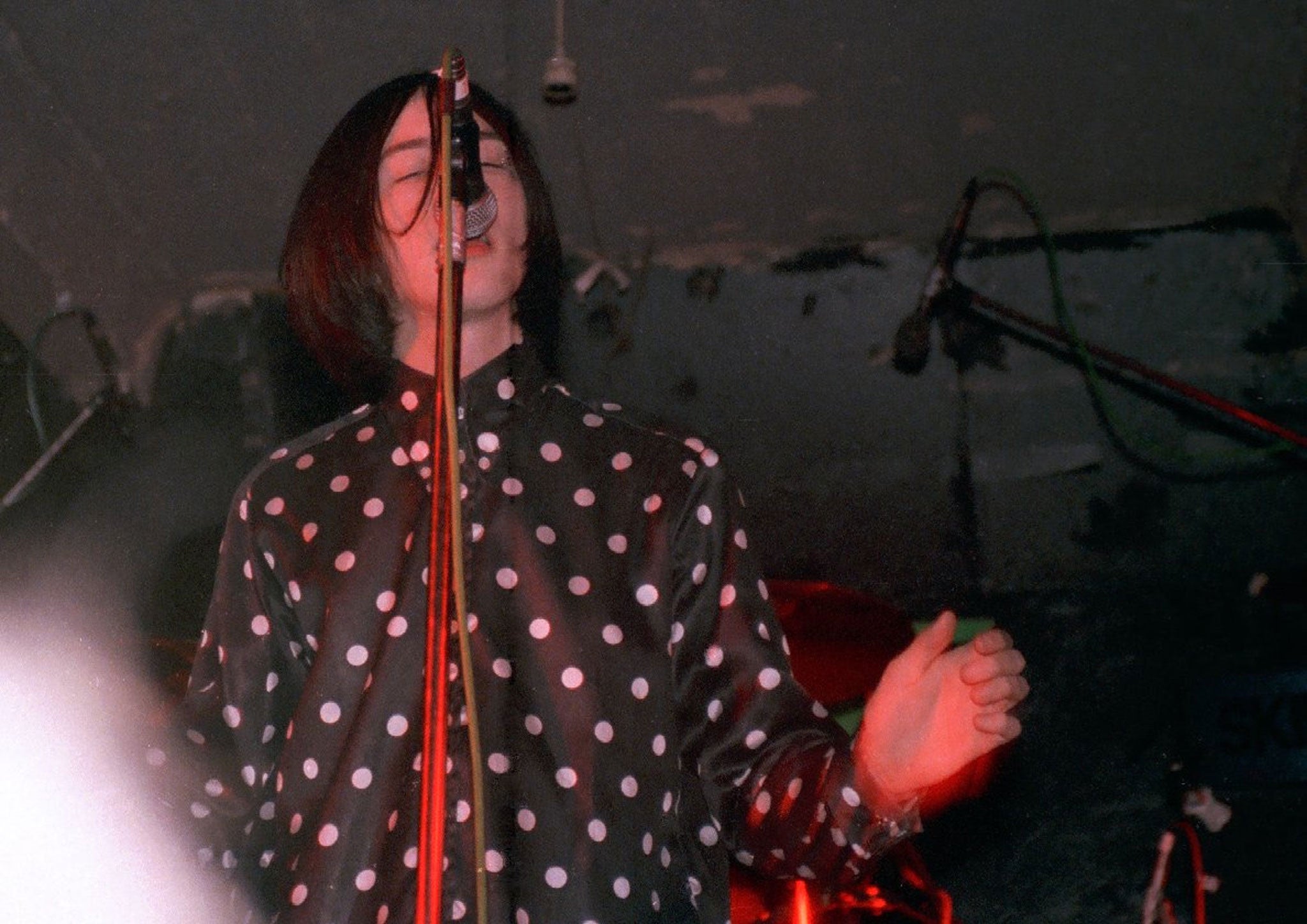 Bobby Gillespie's polka-dotted shirt, fastened high at the throat, reappears at both Burberry Prorsum and Saint Laurent