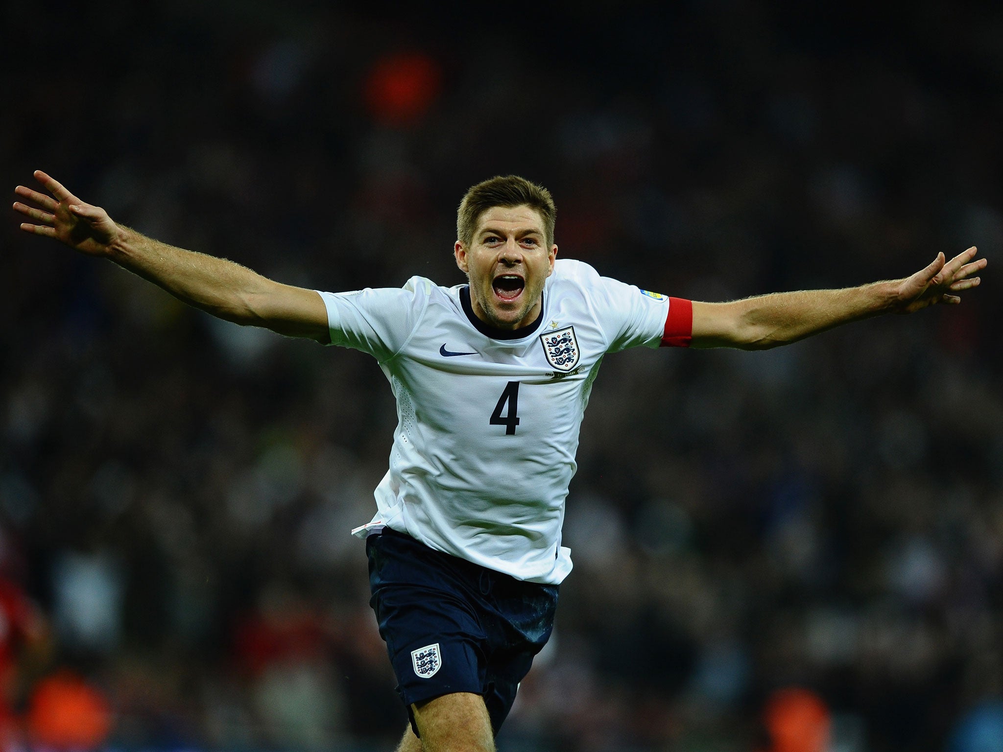 Steven Gerrard celebrates his goal for England against Poland that sent them through to next year's World Cup in Brazil