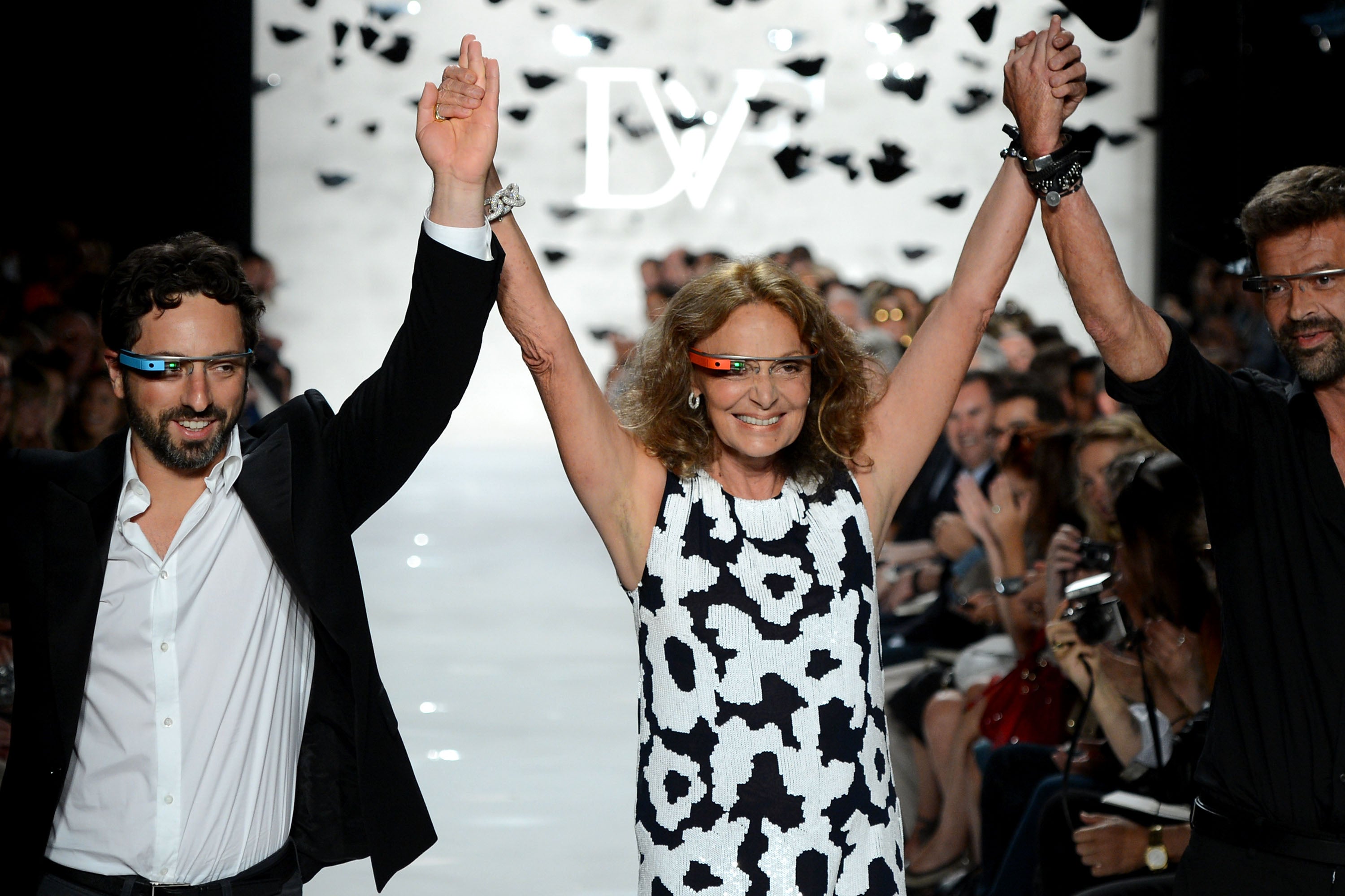 Here's to us: Google co-founder Sergey Brin, and designers Diane Von Furstenberg and Yvan Mispelaere show off Google Glass during New York fashion week.