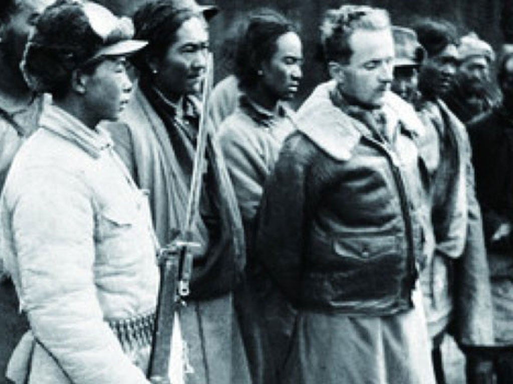Ford is paraded by Chinese troops after being arrested in 1950