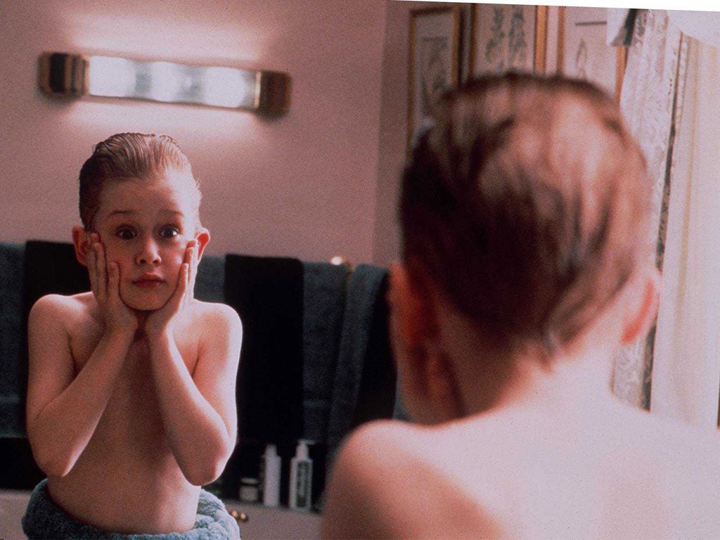 Macaulay Culkin as an 8-year old left behind during a family holiday in Home Alone
