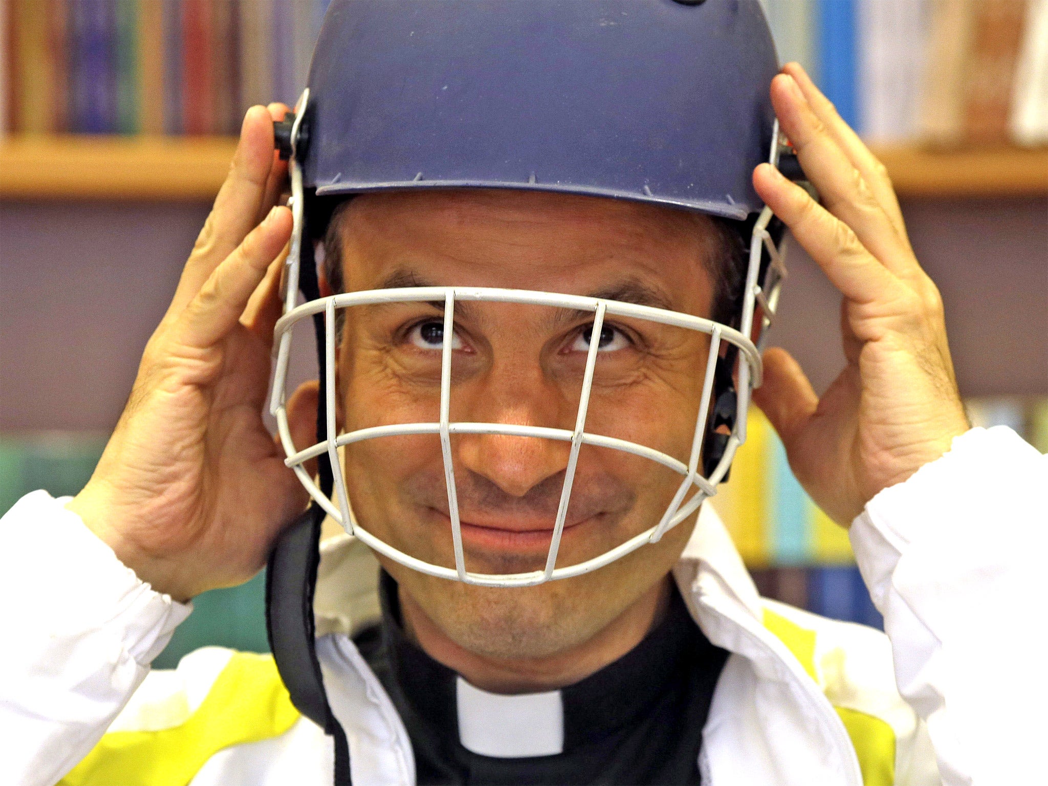 Monsignor Sanchez de Toca y Alameda, undersecretary of the Pontifical Council for Culture, wears a cricket helmet during the presentation of the Vatican cricket club at the Vatican