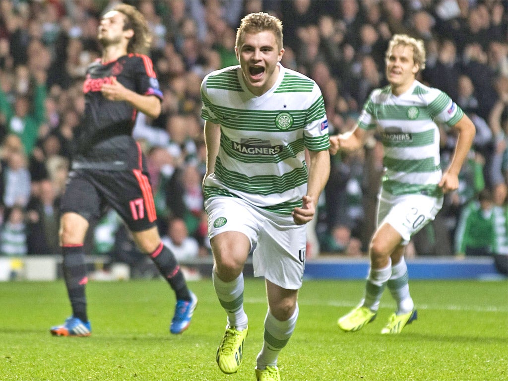 James Forrest celebrates as his penalty gives Celtic the lead