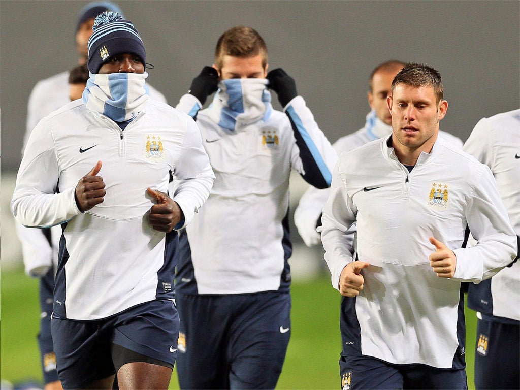 Micah Richards and Matija Nastasic guard against the cold