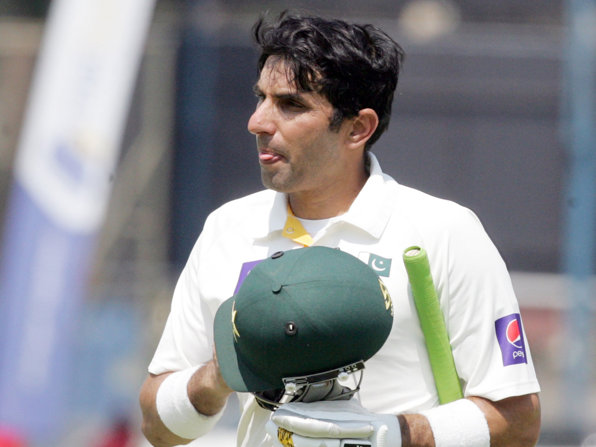Misbah ul-Haq departs the field after his side lose to Zimbabwe
