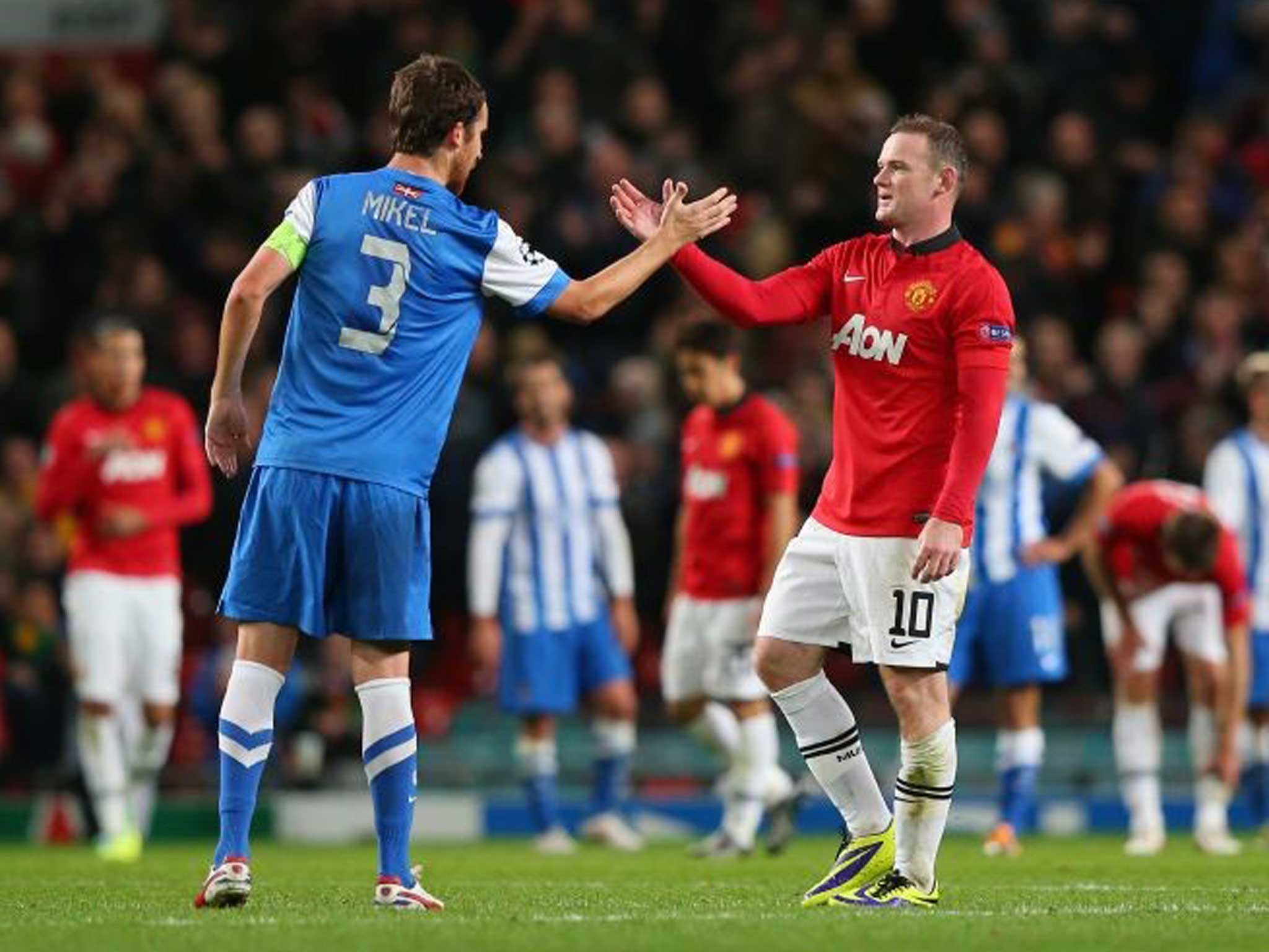 Wayne Rooney of Manchester United shakes hands with Mikel Gonzalez of Real Sociedad at the end of the UEFA Champions League Group A match 