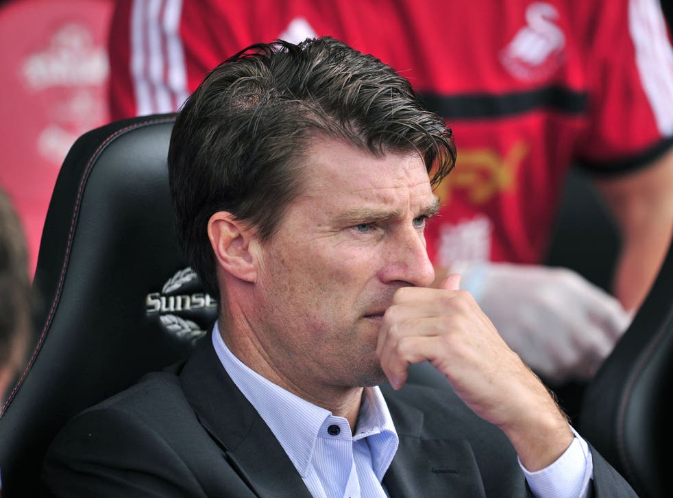 Swansea City's Danish manger Michael Laudrup is pictured before the start of the English Premier League football match between Southampton and Swansea City