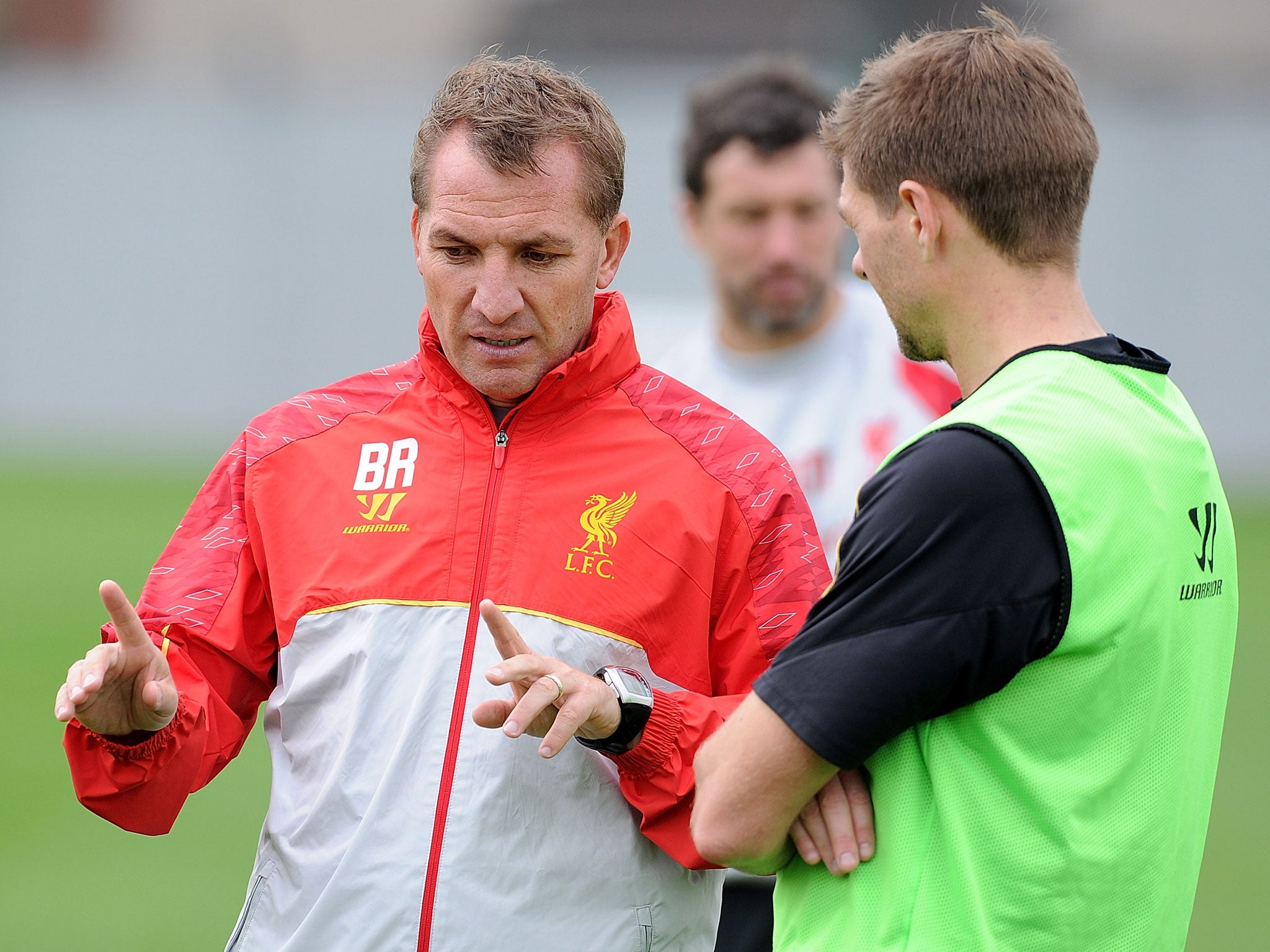 Brendan Rodgers (left) and Steven Gerrard talk tactics during Liverpool training