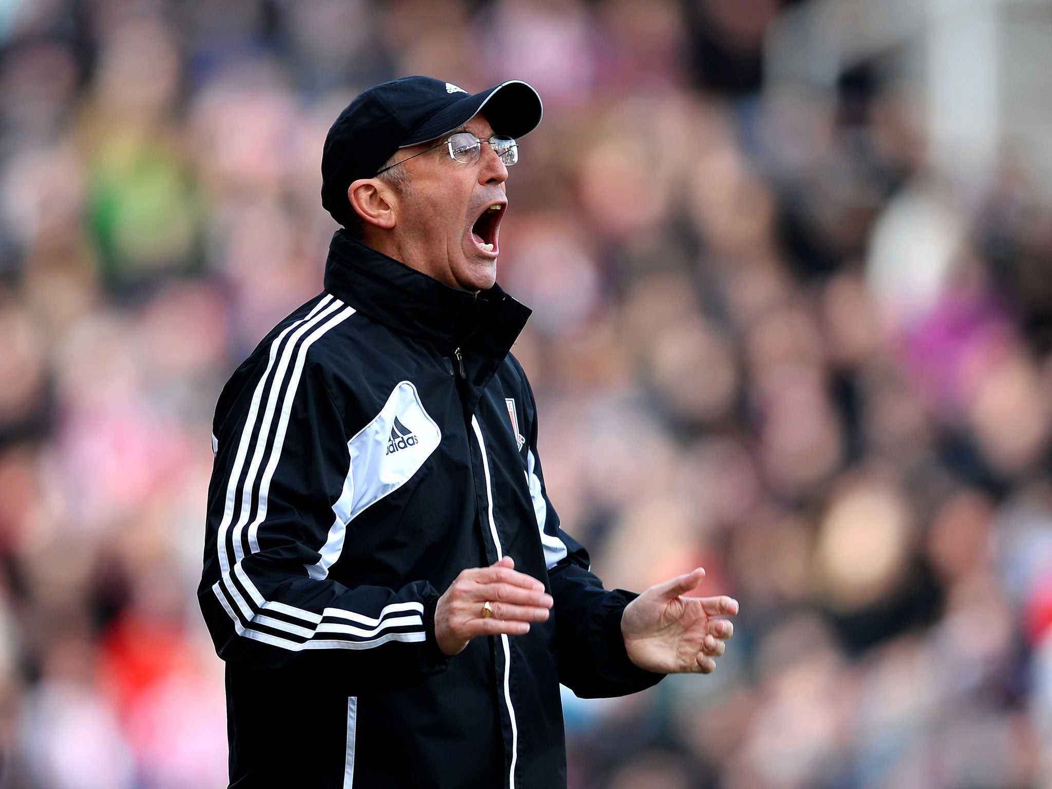 Tony Pulis the Stoke manager shouts instructions to his players