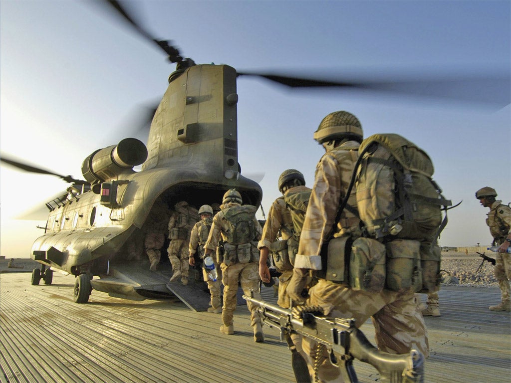 British soldiers board Chinook in Camp Bastion
