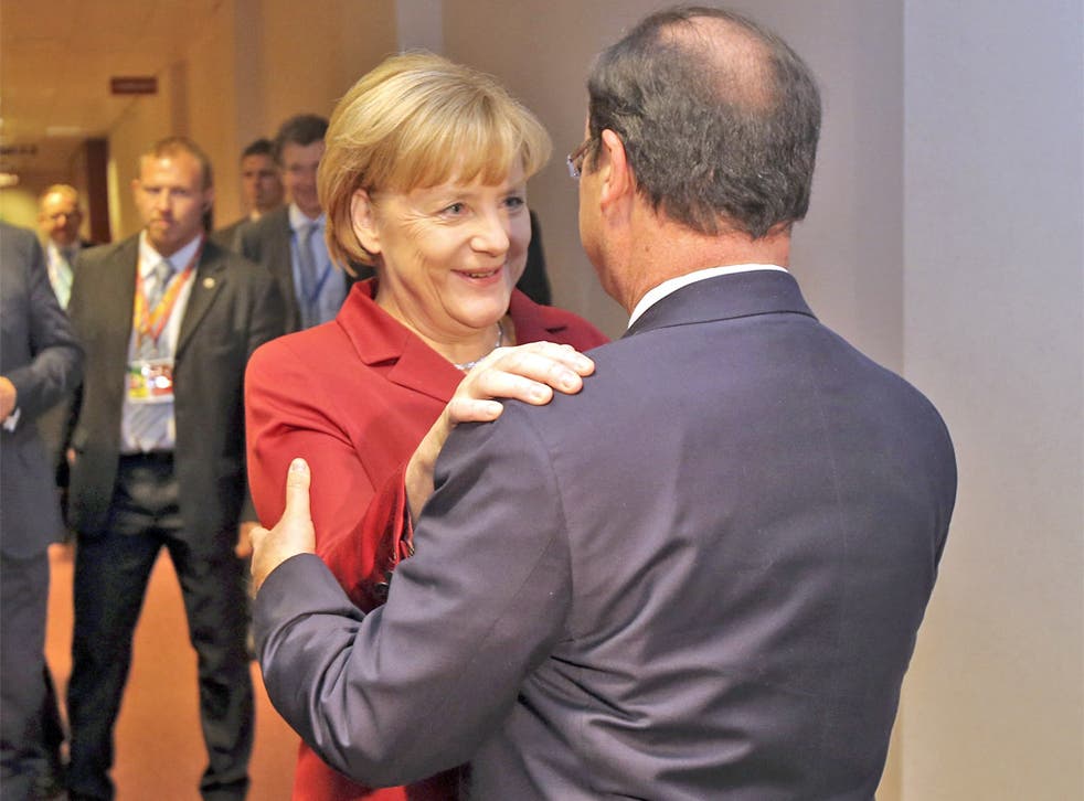Angela Merkel greets François Hollande before a bilateral meeting on the sidelines of the summit