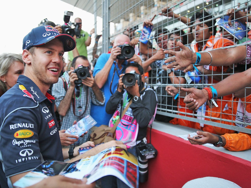 Sebastian Vettel meets fans in India. The German can clinch the title if he finishes fifth or higher this weekend