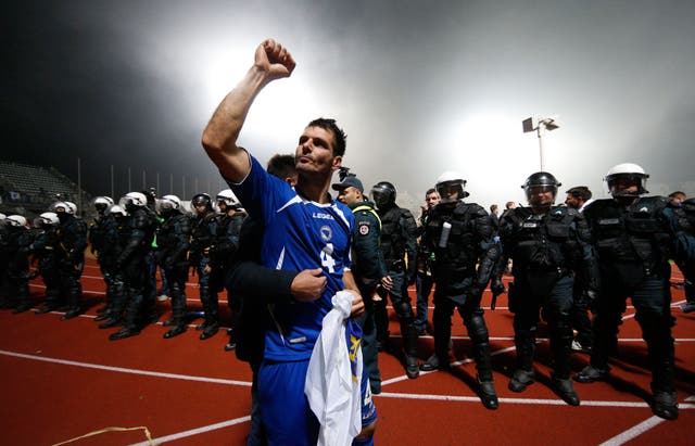 Bosnia's Emir Spahic celebrates his team's victory over Lithuania on 15 October, 2013