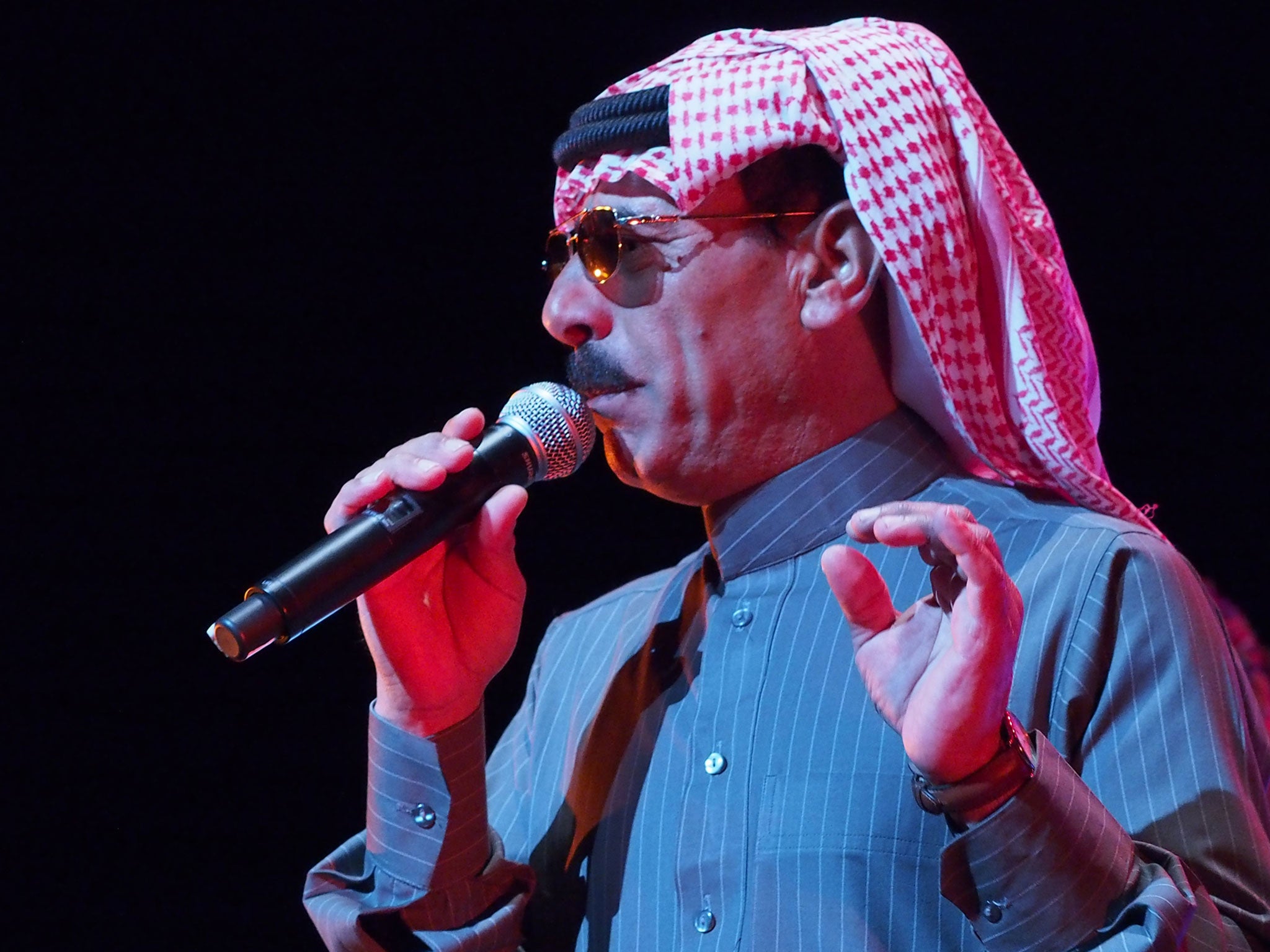 Omar Souleyman is seen here performing earlier this year in Texas at a benefit concert for victims of the Syrian conflict.