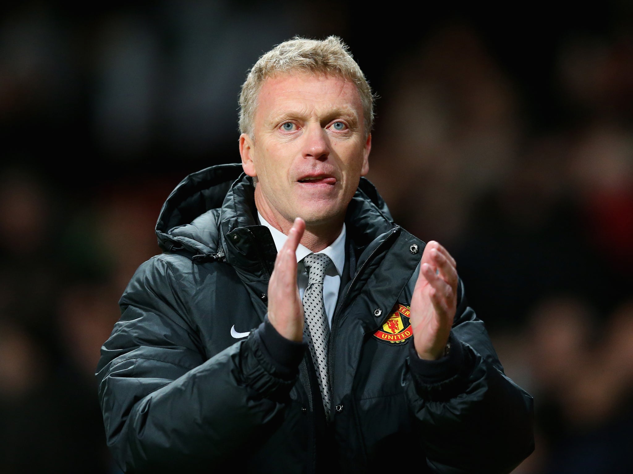 David Moyes applauds the Manchester United fans after their 1-0 win over Real Sociedad